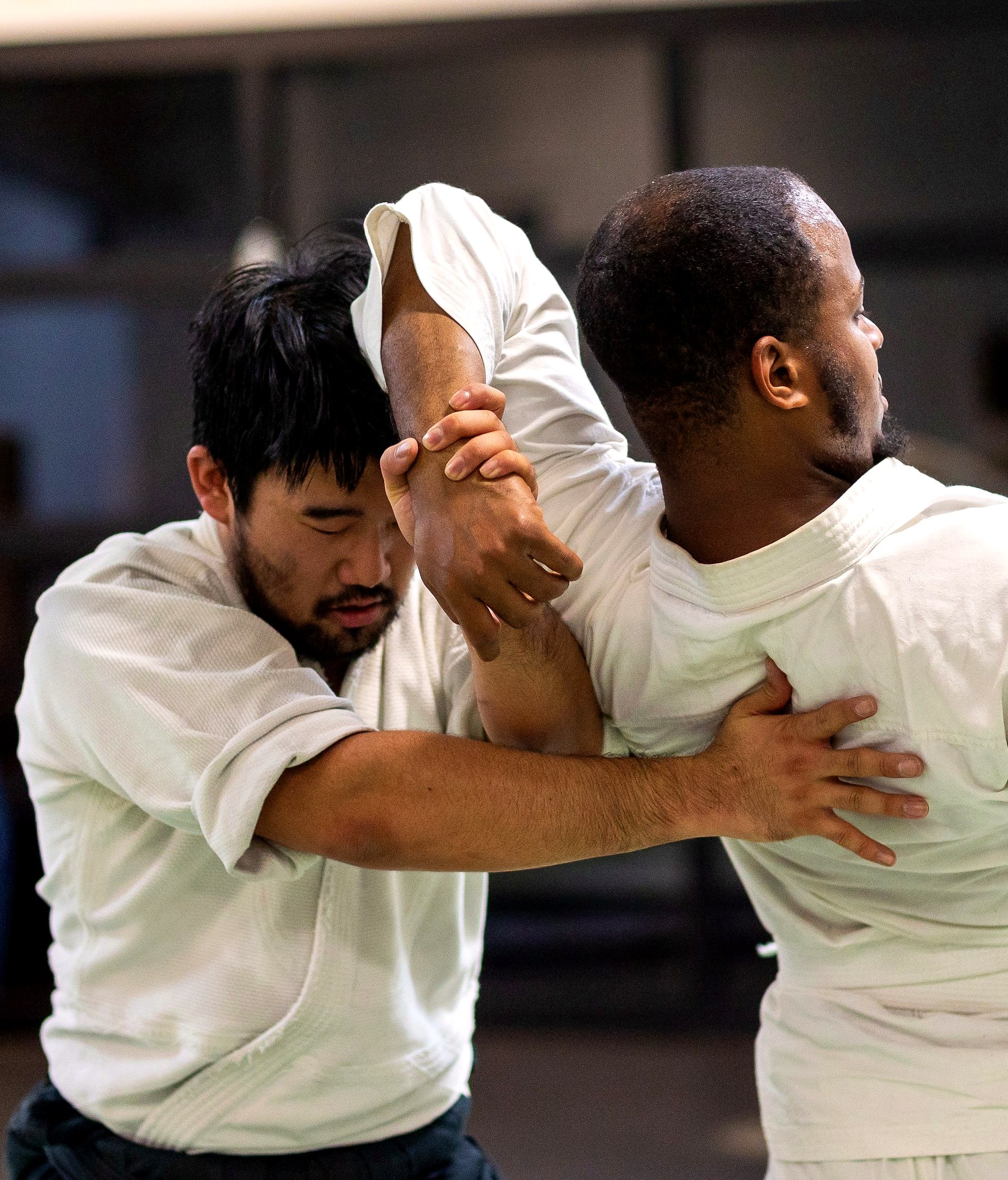 Two students working through a technique at close range