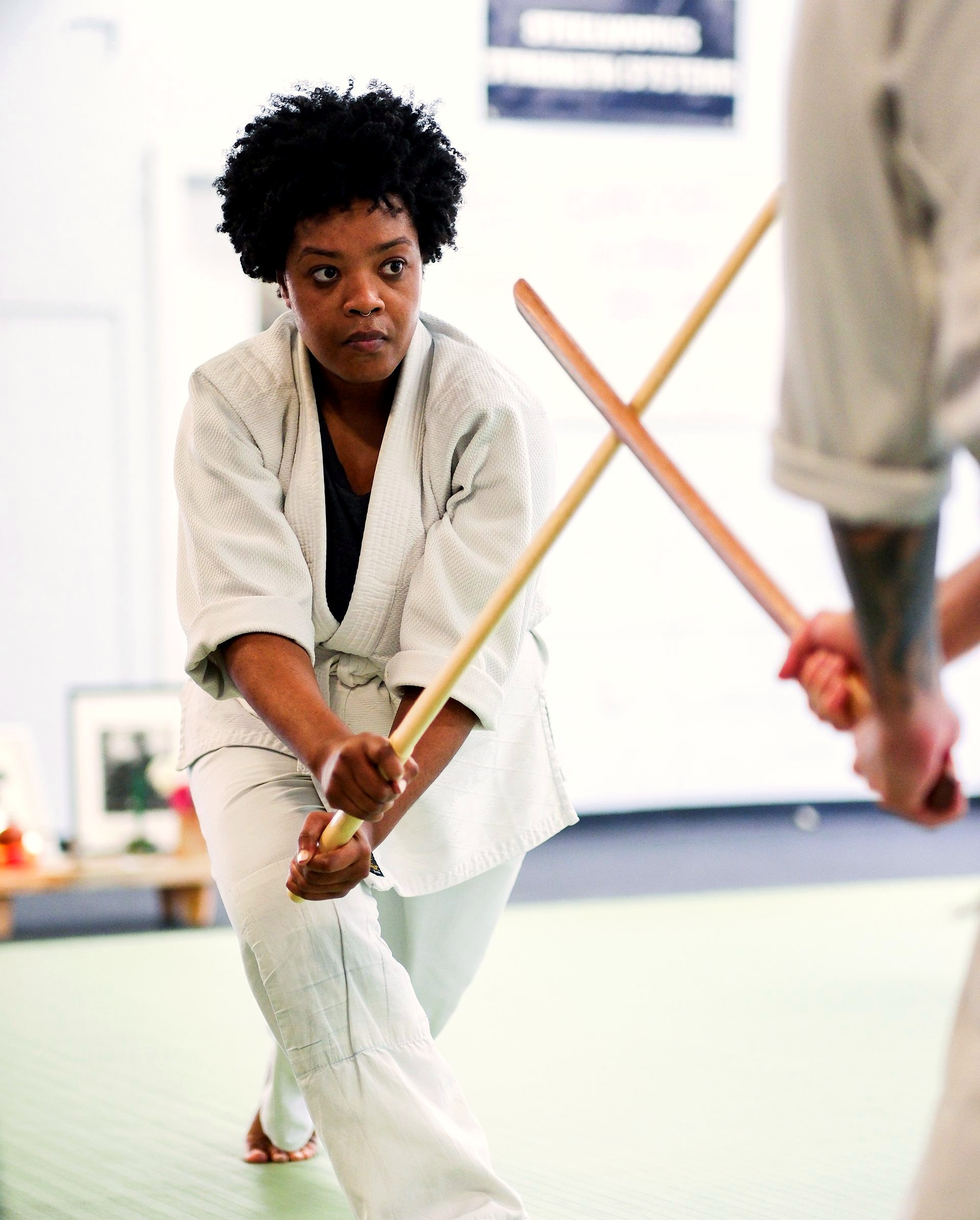 A student holding her line during bokken practice