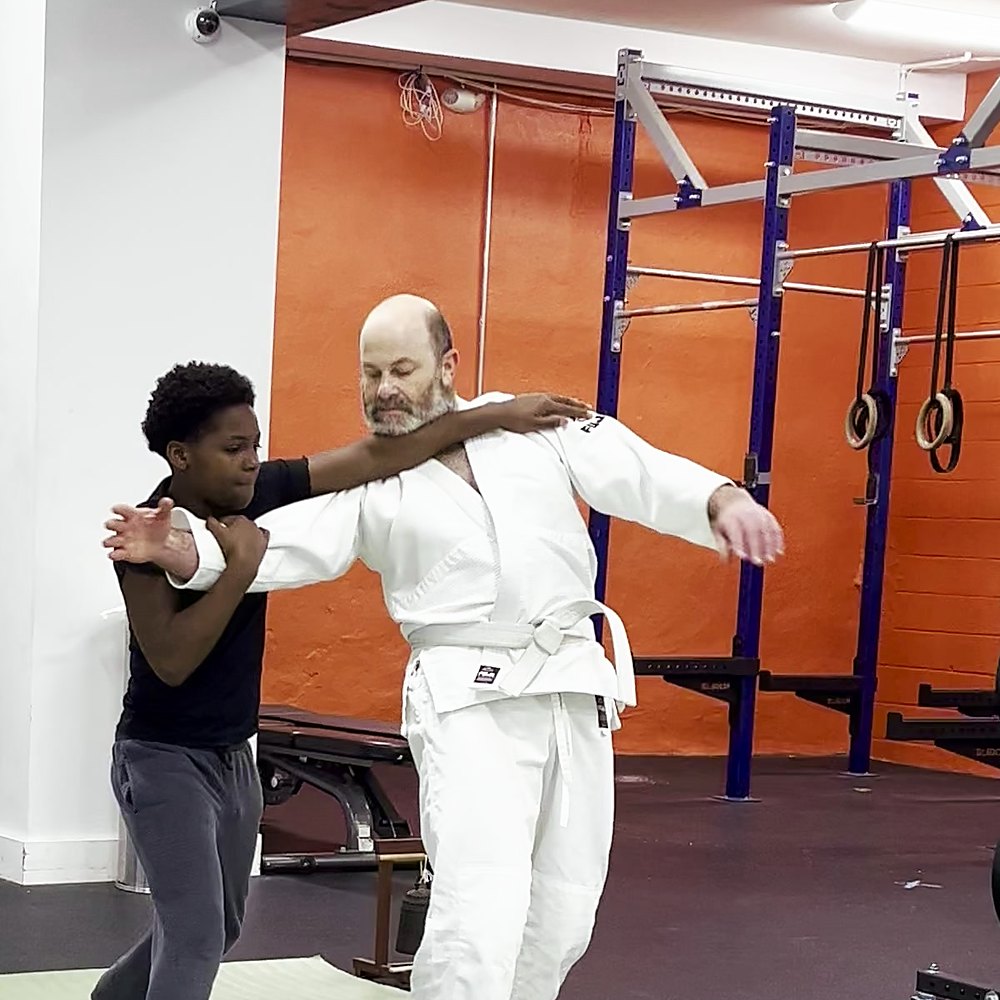 A teenage student squaring up to an older partner
